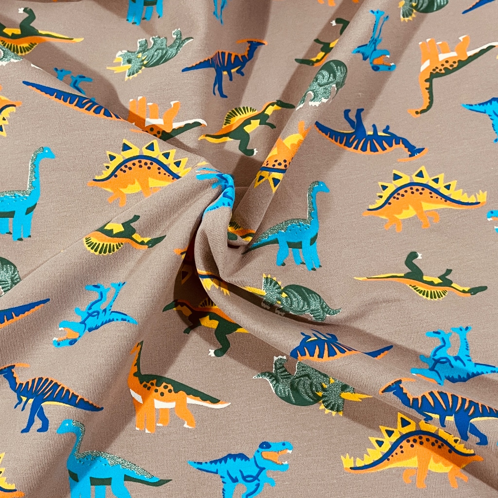 Bavlněný úplet - dinosauři na hnědé